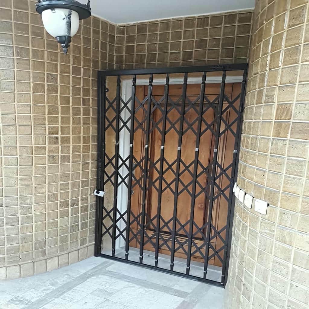 نصب درب حفاظ آکاردئونی چهارگل در محمدشهر