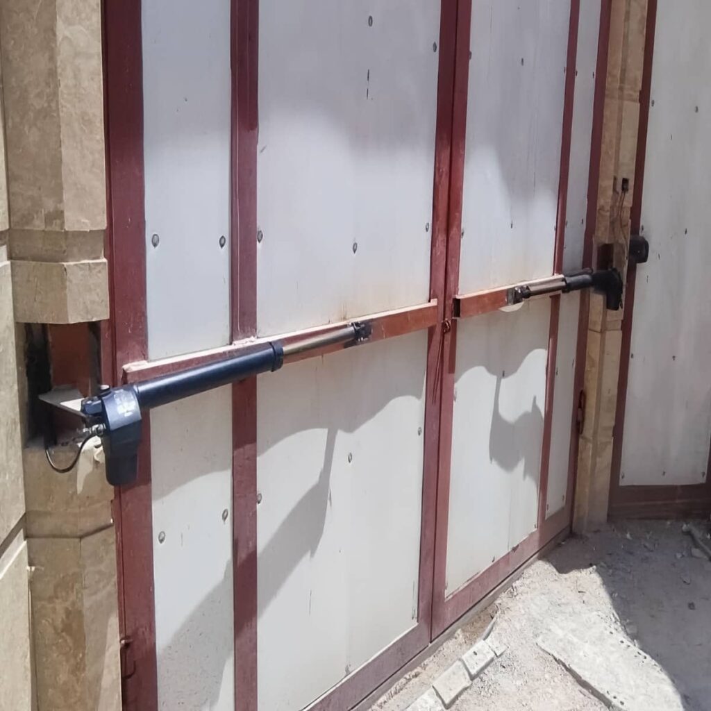 تعمیر جک درب پارکینگ بی صدا کم تردد و تنظیم توقف نرم